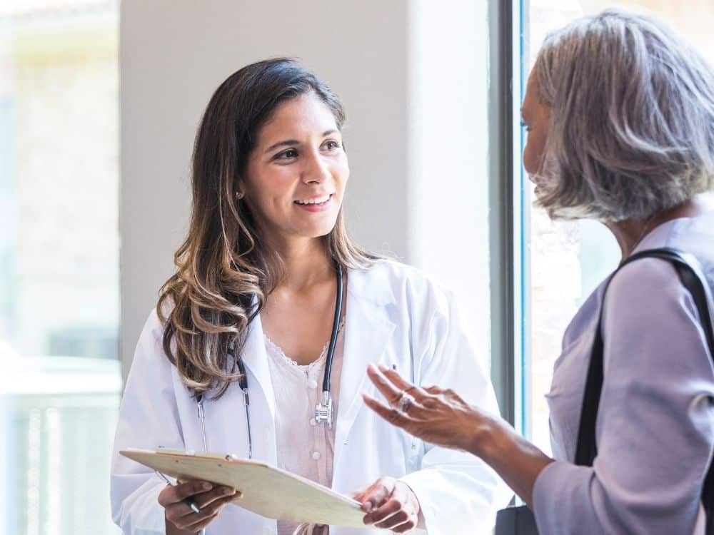 female doctor talking to a patient